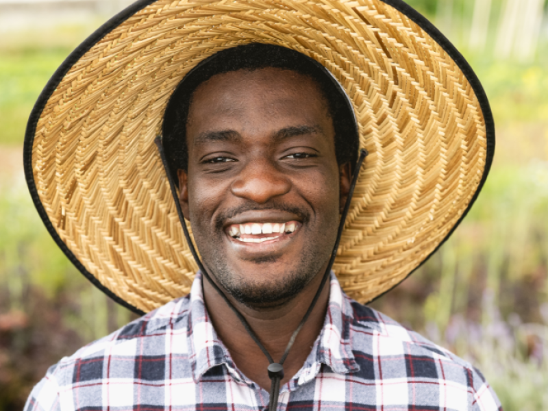 happy-african-farmer-working-in-farmhouse-country-2021-09-03-16-05-10-utc